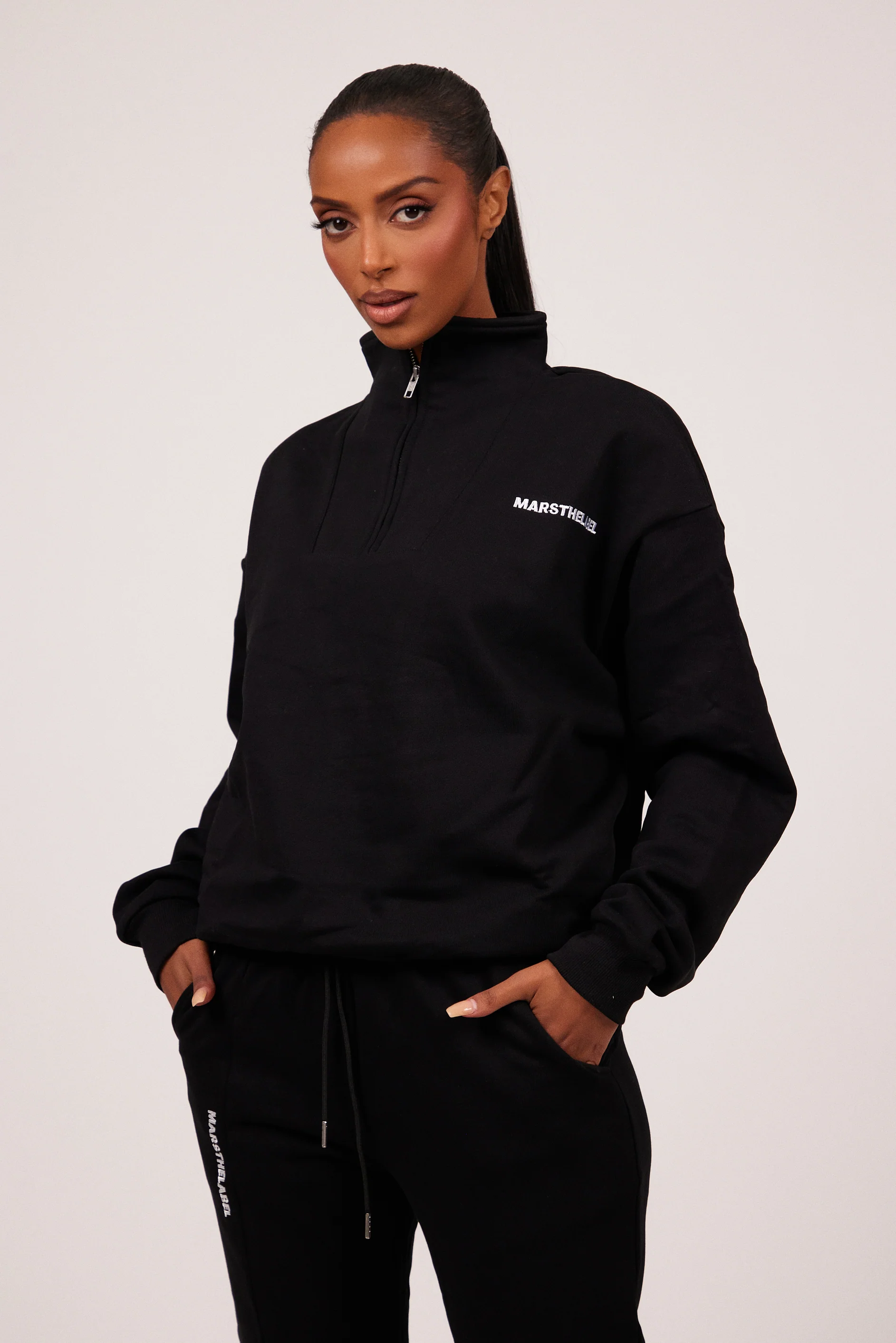 The Essentials Quarter Zip in Black