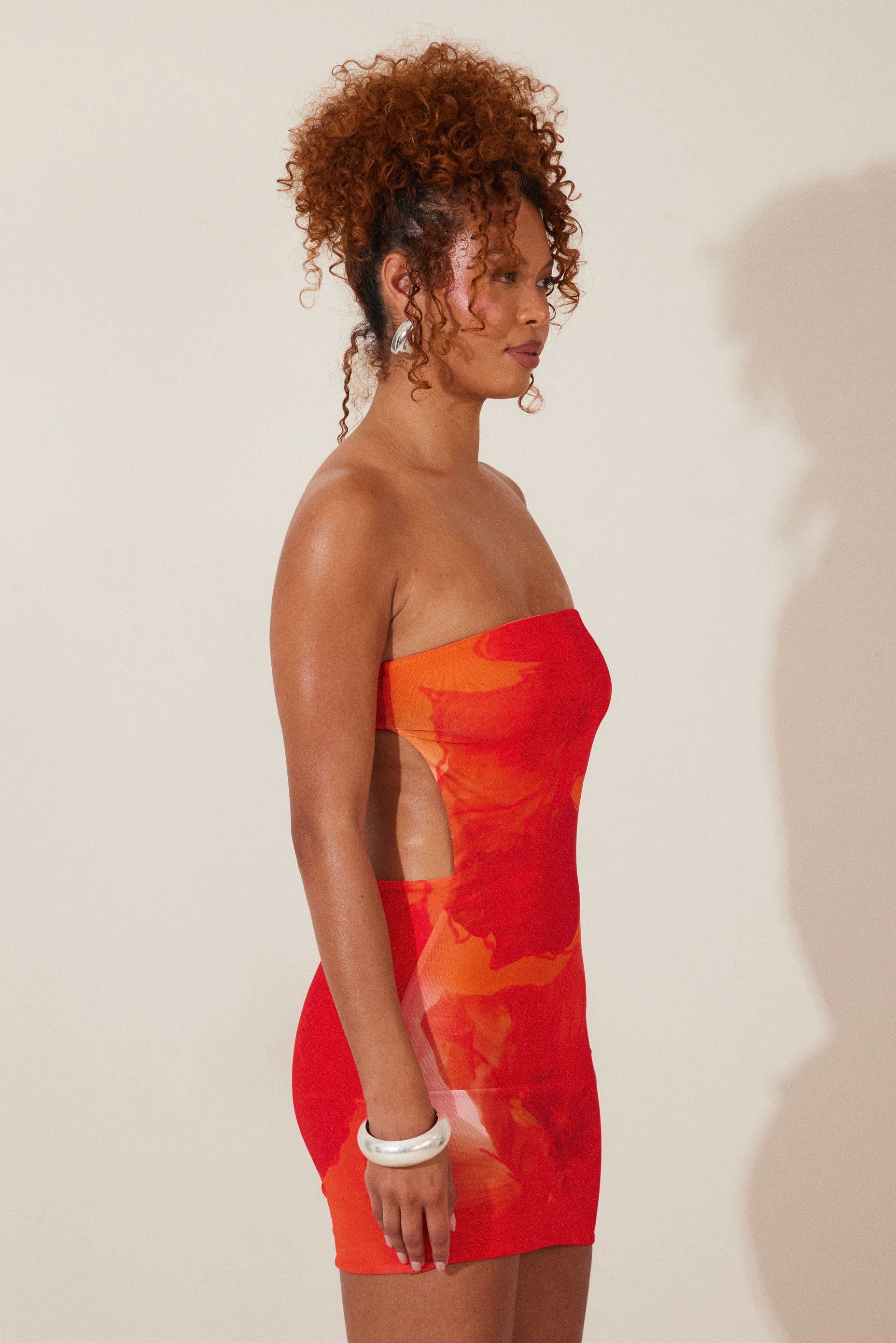 The Draped Mini Dress in Orange Print - Image 3