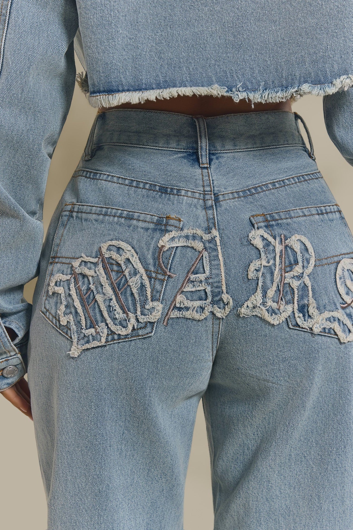 The Kali Mid-Rise Jeans in Light Wash Blue - Image 4